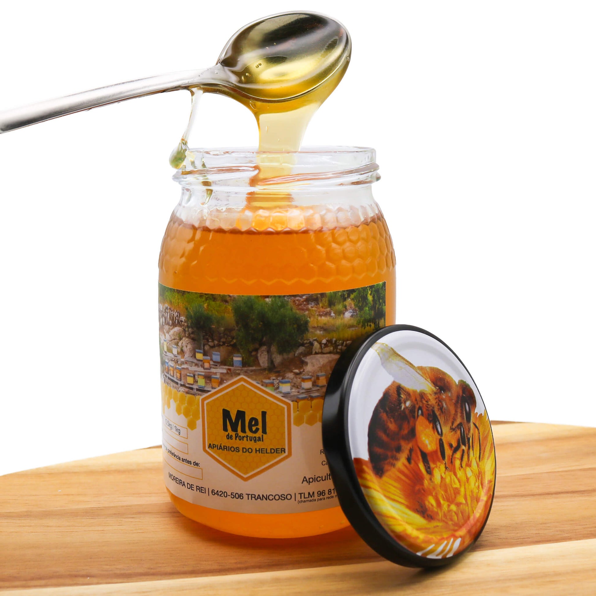 honey on wooden board with spoon