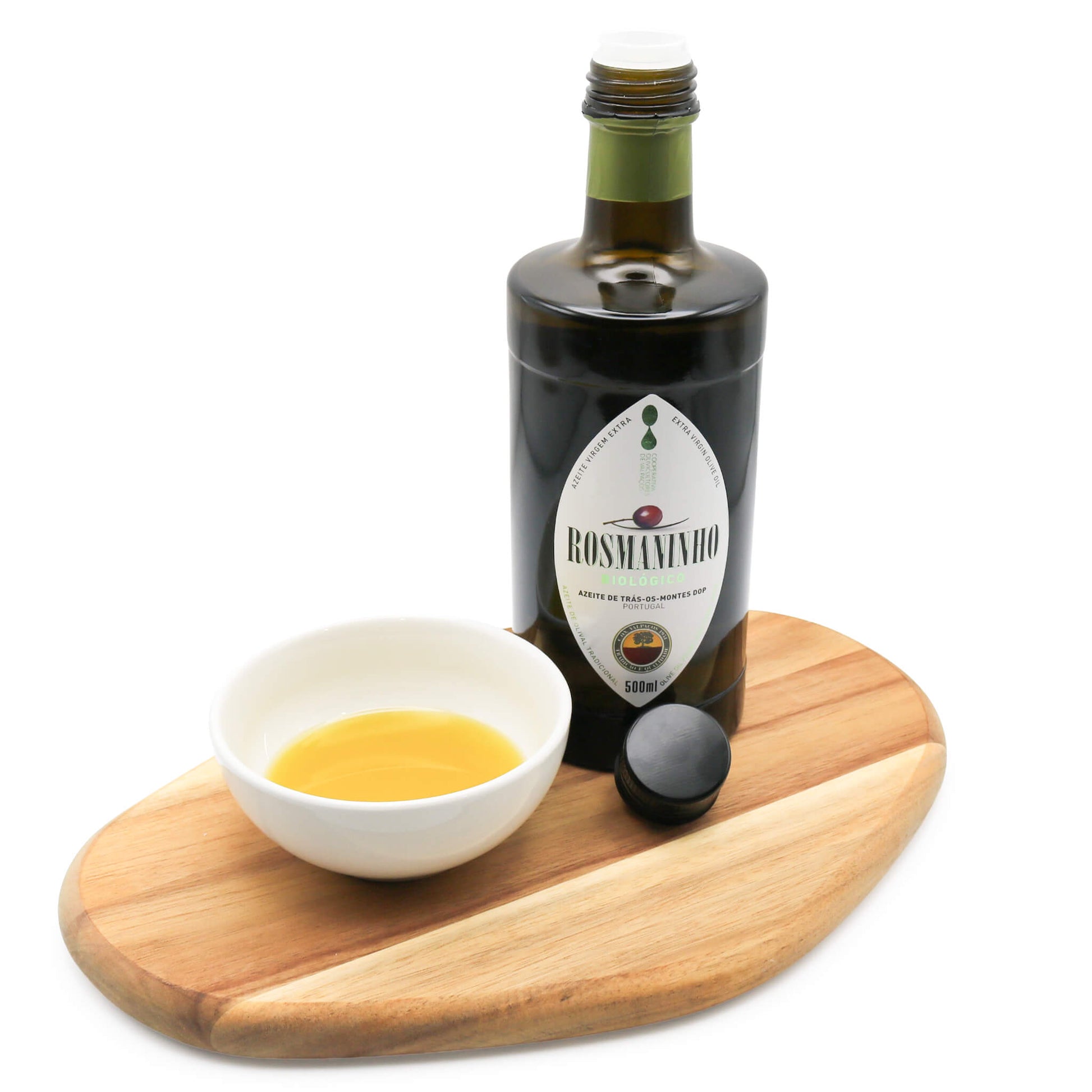 Olive oil on wooden board with bowl of oil