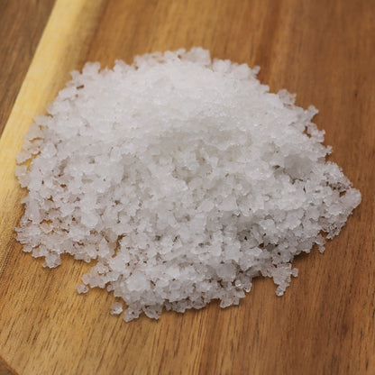 White necton sea salt on a wooden board